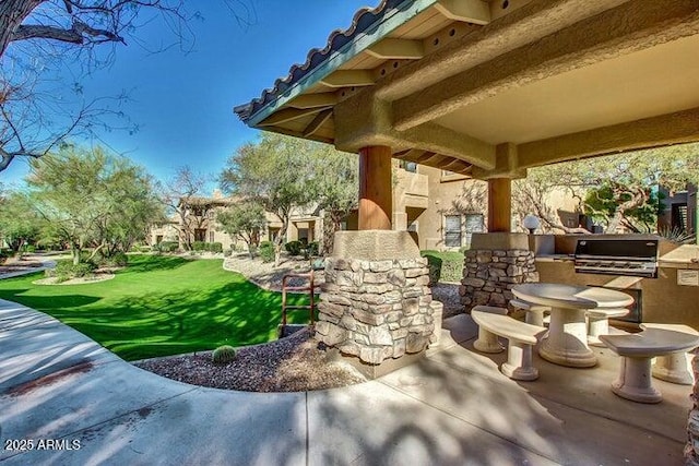11500 E Cochise Dr Unit 1015, Scottsdale, AZ 85259 - view of patio with a grill and an outdoor kitchen