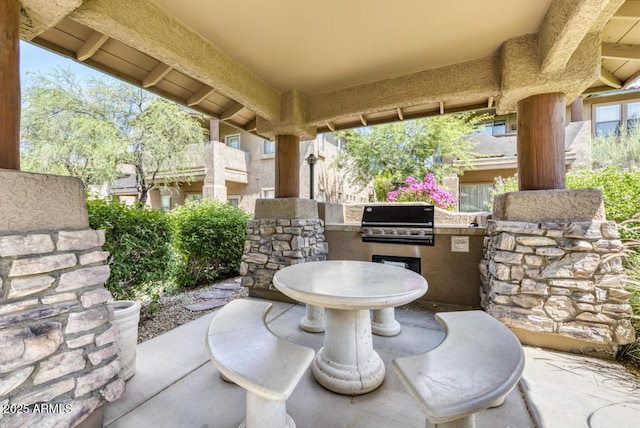 11500 E Cochise Dr Unit 1015, Scottsdale, AZ 85259 - view of patio with grilling area and an outdoor kitchen