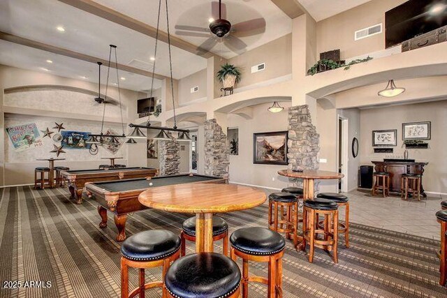 11500 E Cochise Dr Unit 1015, Scottsdale, AZ 85259 - game room featuring ceiling fan, visible vents, arched walkways, a high ceiling, and ornate columns