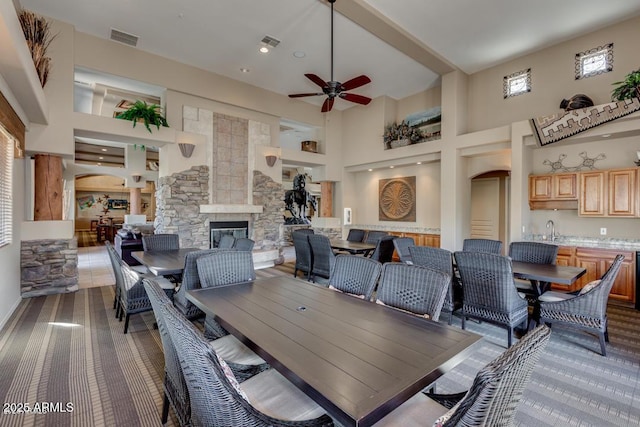11500 E Cochise Dr Unit 1015, Scottsdale, AZ 85259 - dining area with arched walkways, a high ceiling, decorative columns, and visible vents