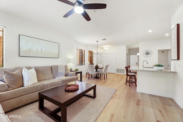 11500 E Cochise Dr Unit 1015, Scottsdale, AZ 85259 - living area with visible vents, baseboards, ceiling fan with notable chandelier, light wood finished floors, and recessed lighting