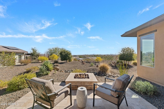 view of patio with an outdoor fire pit