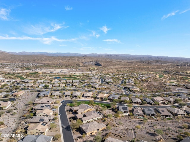 birds eye view of property with a mountain view