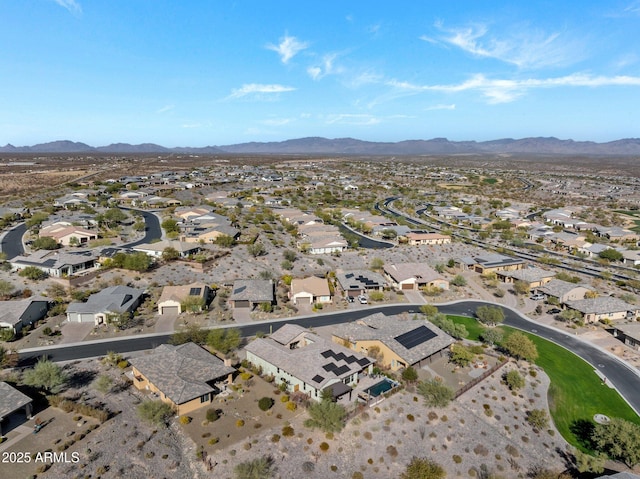 birds eye view of property with a mountain view