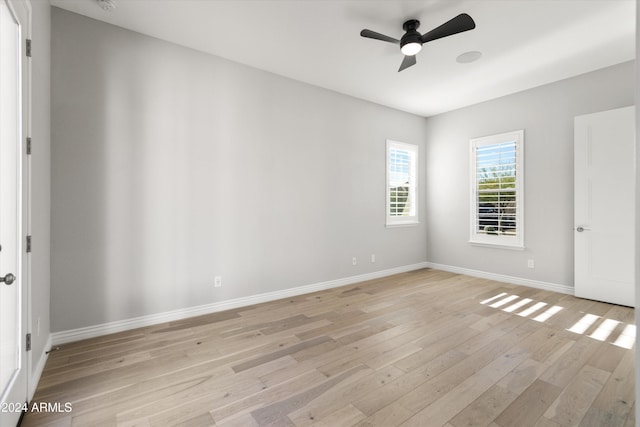 unfurnished room featuring light wood-type flooring and ceiling fan