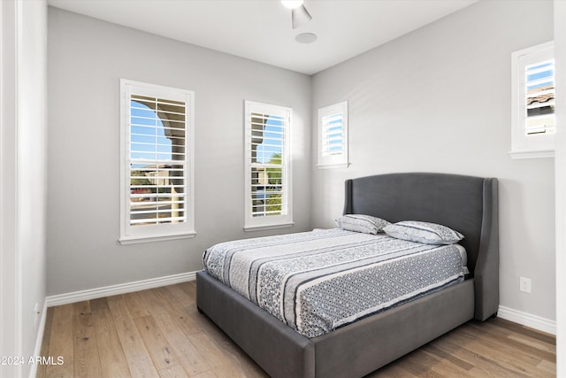 bedroom featuring hardwood / wood-style floors and ceiling fan