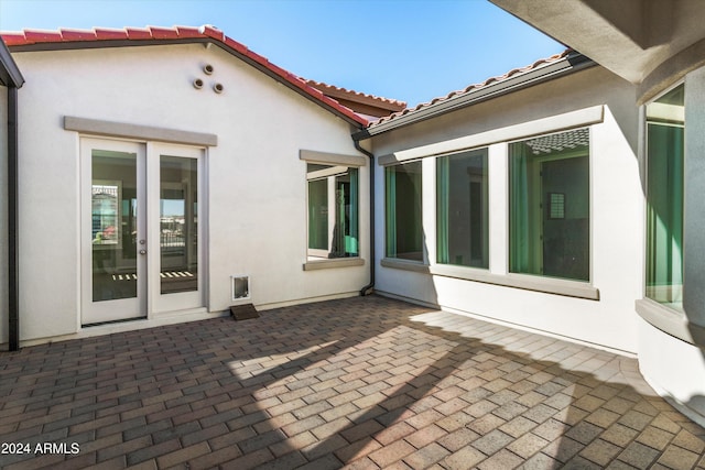 rear view of property with a patio and french doors