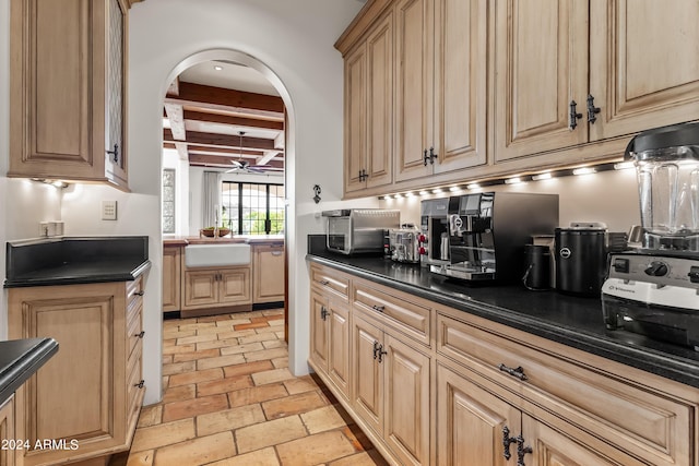 kitchen with beam ceiling and sink