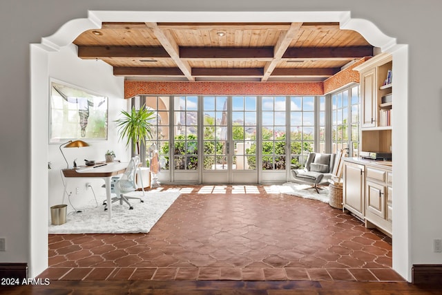 unfurnished sunroom with beamed ceiling and wood ceiling