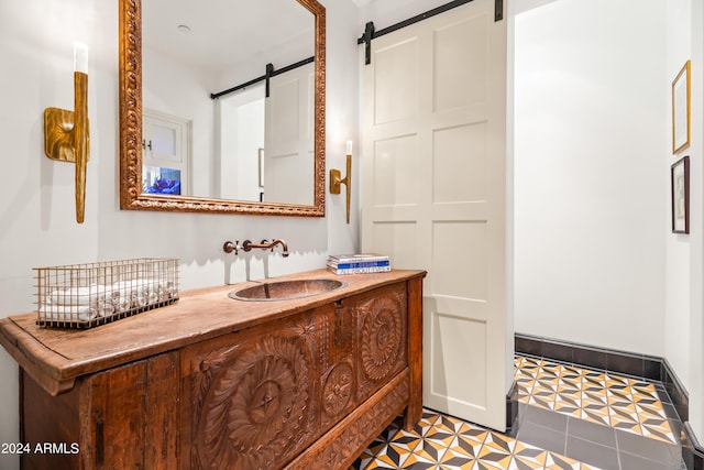 bathroom with vanity and tile patterned floors