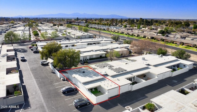 birds eye view of property featuring a mountain view