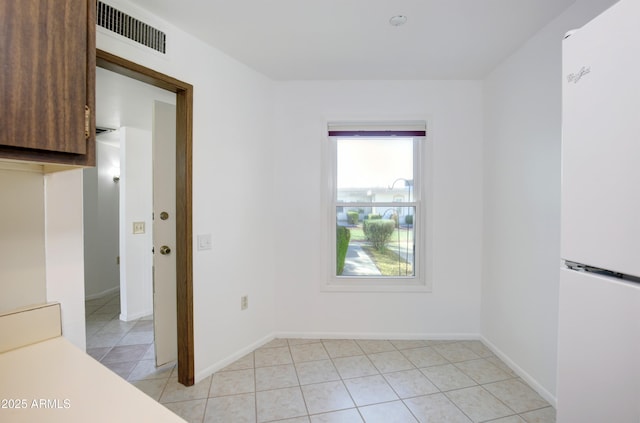 view of tiled spare room