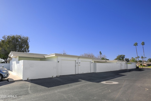 view of side of property with a garage