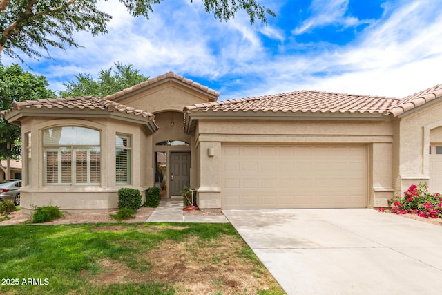 23756 S Vacation Way, Sun Lakes, AZ 85248 - mediterranean / spanish house featuring an attached garage, driveway, stucco siding, and a tiled roof