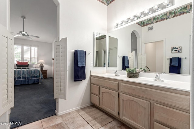 23756 S Vacation Way, Sun Lakes, AZ 85248 - ensuite bathroom with a ceiling fan, double vanity, tile patterned flooring, vaulted ceiling, and baseboards