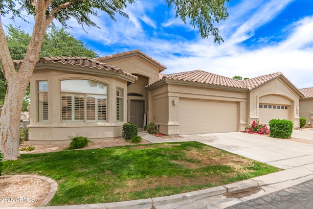 23756 S Vacation Way, Sun Lakes, AZ 85248 - mediterranean / spanish house with a garage, concrete driveway, stucco siding, a front lawn, and a tile roof