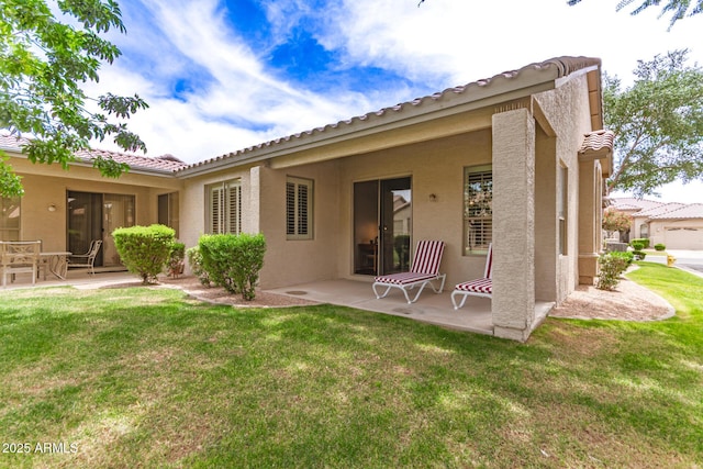 23756 S Vacation Way, Sun Lakes, AZ 85248 - back of property with stucco siding, a patio, a yard, and a tile roof