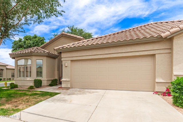 23756 S Vacation Way, Sun Lakes, AZ 85248 - mediterranean / spanish-style home featuring stucco siding, concrete driveway, an attached garage, and a tile roof