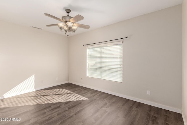 spare room with hardwood / wood-style flooring and ceiling fan