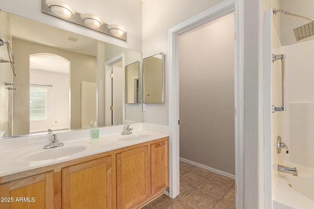 bathroom featuring bathtub / shower combination, vanity, and tile patterned floors