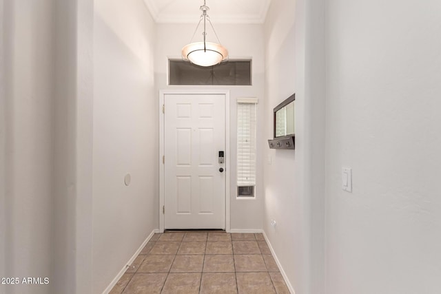 doorway to outside featuring light tile patterned floors and ornamental molding