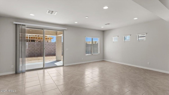 spare room featuring baseboards, visible vents, recessed lighting, and tile patterned floors
