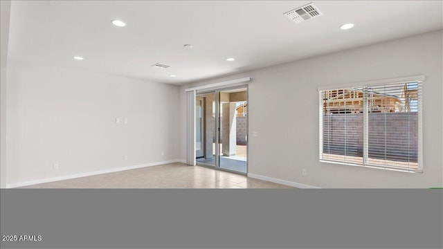 spare room with recessed lighting, visible vents, and baseboards