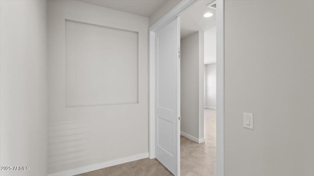 corridor featuring baseboards