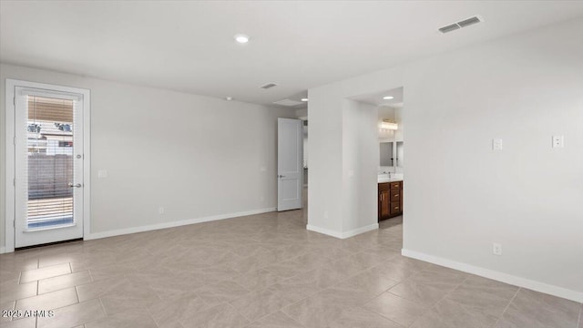 unfurnished room with visible vents, baseboards, recessed lighting, and light tile patterned floors