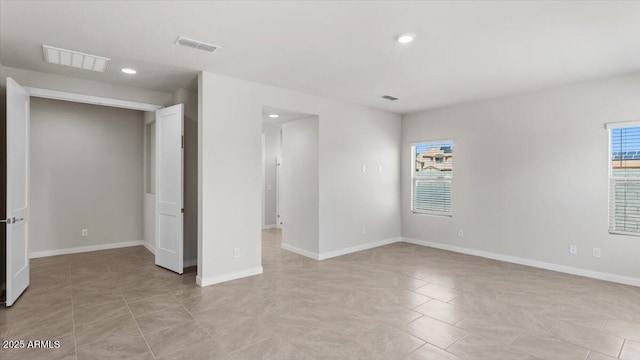 spare room with visible vents, recessed lighting, and light tile patterned flooring