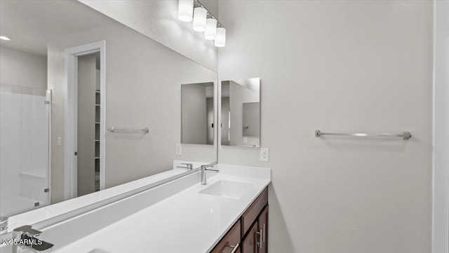 bathroom featuring vanity and a shower
