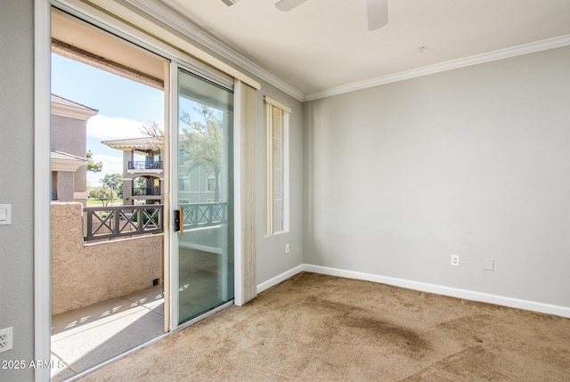unfurnished room featuring crown molding, carpet flooring, and ceiling fan
