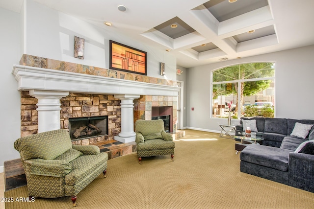 living room featuring a stone fireplace, a towering ceiling, beamed ceiling, carpet floors, and coffered ceiling