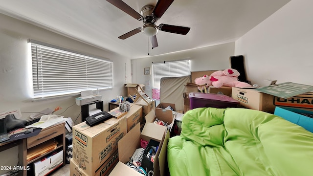 interior space with a wealth of natural light and ceiling fan