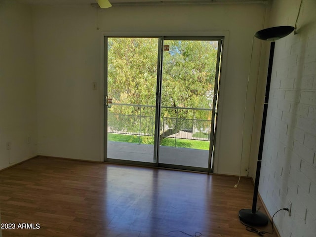 unfurnished room with ceiling fan and hardwood / wood-style floors