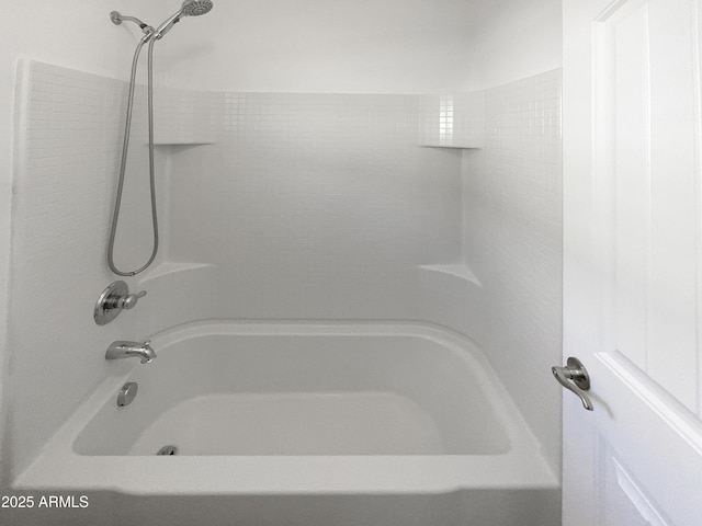 bathroom with shower / tub combination