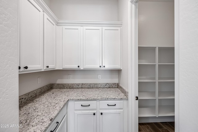 898 E Ladbroke Way, Gilbert, AZ 85297 - kitchen featuring white cabinets, light stone counters, and wood finished floors