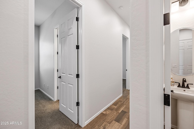 898 E Ladbroke Way, Gilbert, AZ 85297 - corridor featuring baseboards, dark wood-style floors, and arched walkways