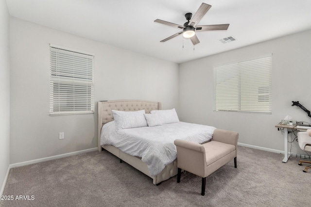 bedroom with light carpet and ceiling fan