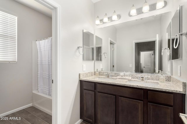 bathroom with shower / tub combo with curtain, vanity, and tile patterned flooring