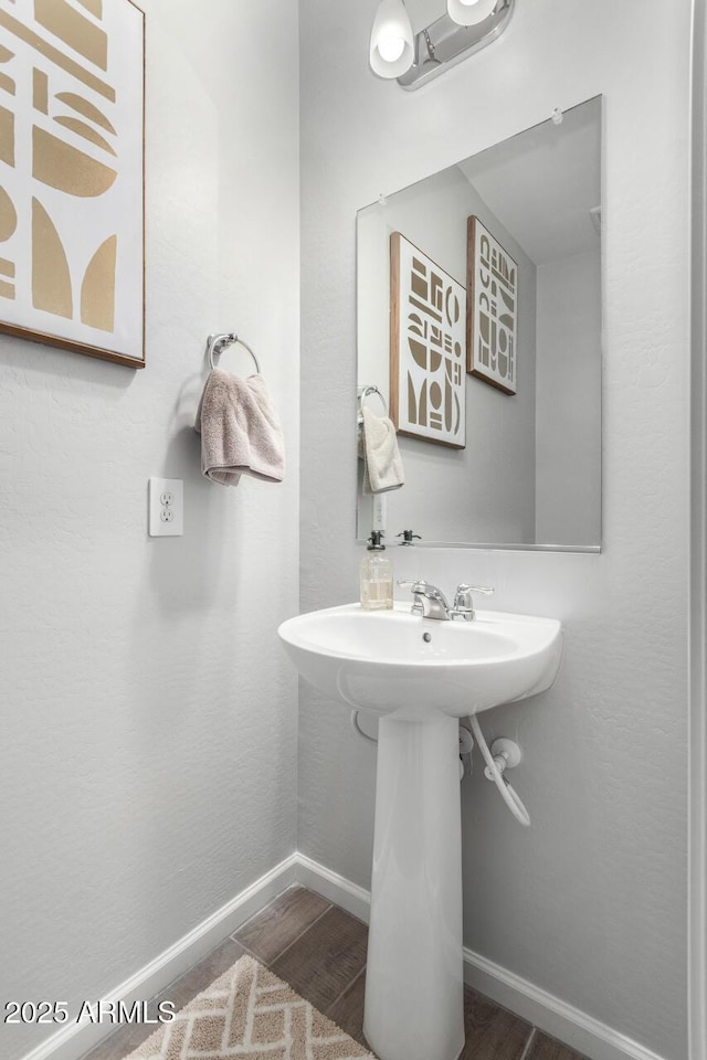 bathroom featuring hardwood / wood-style flooring and sink