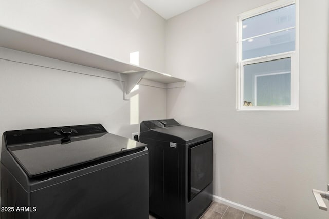 laundry room featuring separate washer and dryer and light wood-type flooring