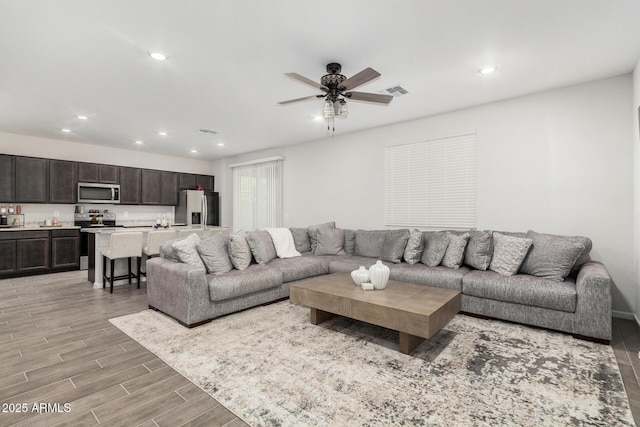 living room featuring ceiling fan