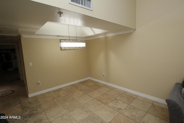 9450 N 95th St Unit 219, Scottsdale, AZ 85258 - unfurnished dining area featuring crown molding, baseboards, and light stone finish floors