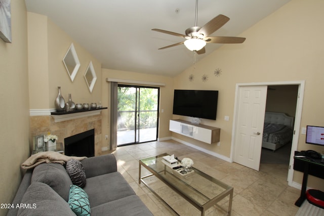 tiled living room featuring a tiled fireplace, high vaulted ceiling, and ceiling fan