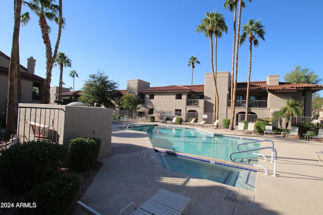 view of swimming pool with a patio area