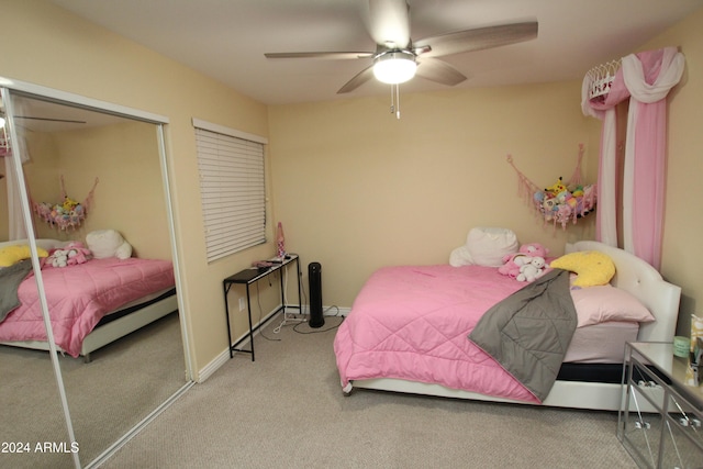 carpeted bedroom featuring a closet and ceiling fan