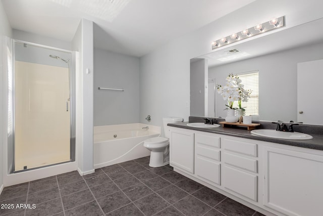 full bathroom with a shower stall, a garden tub, tile patterned floors, and a sink