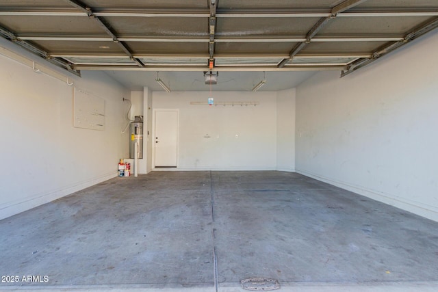 garage with a garage door opener and water heater