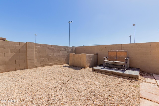 view of yard featuring a patio and a fenced backyard